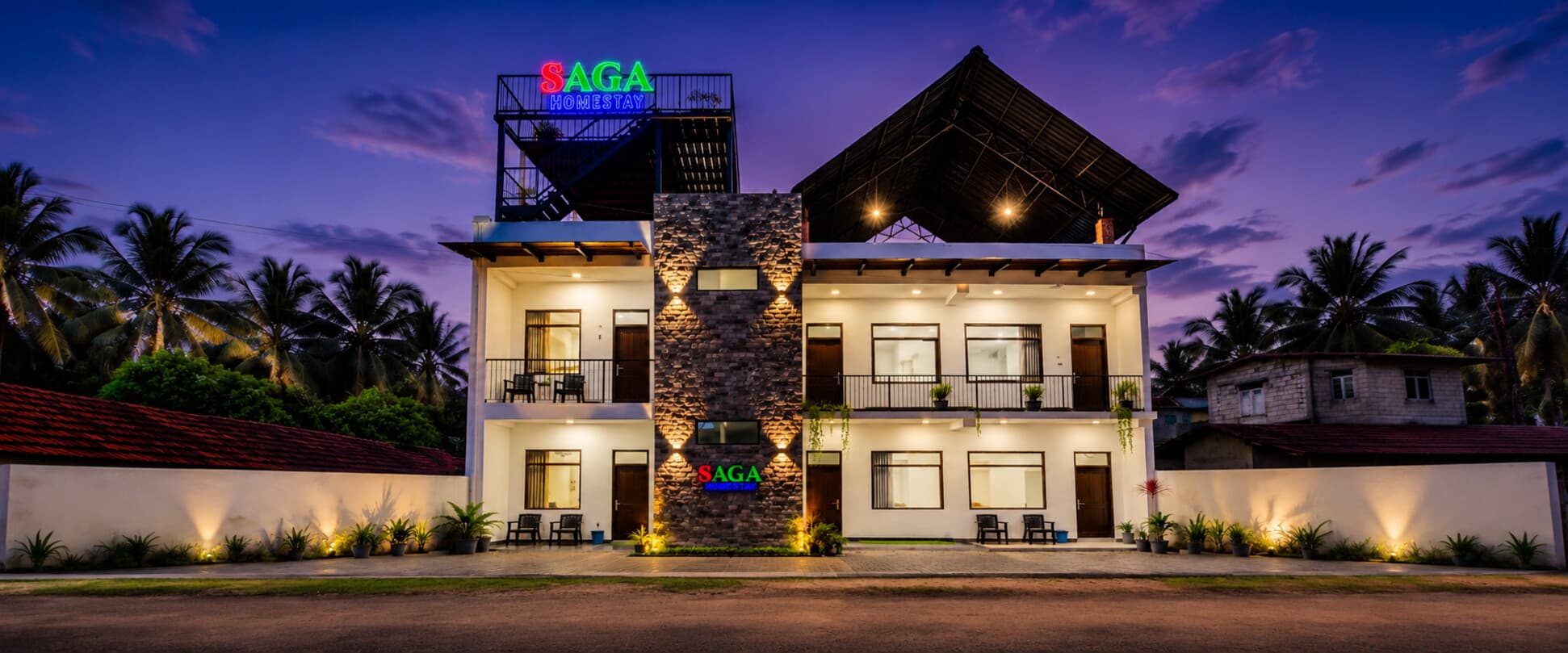 Saga Homestay building at dusk